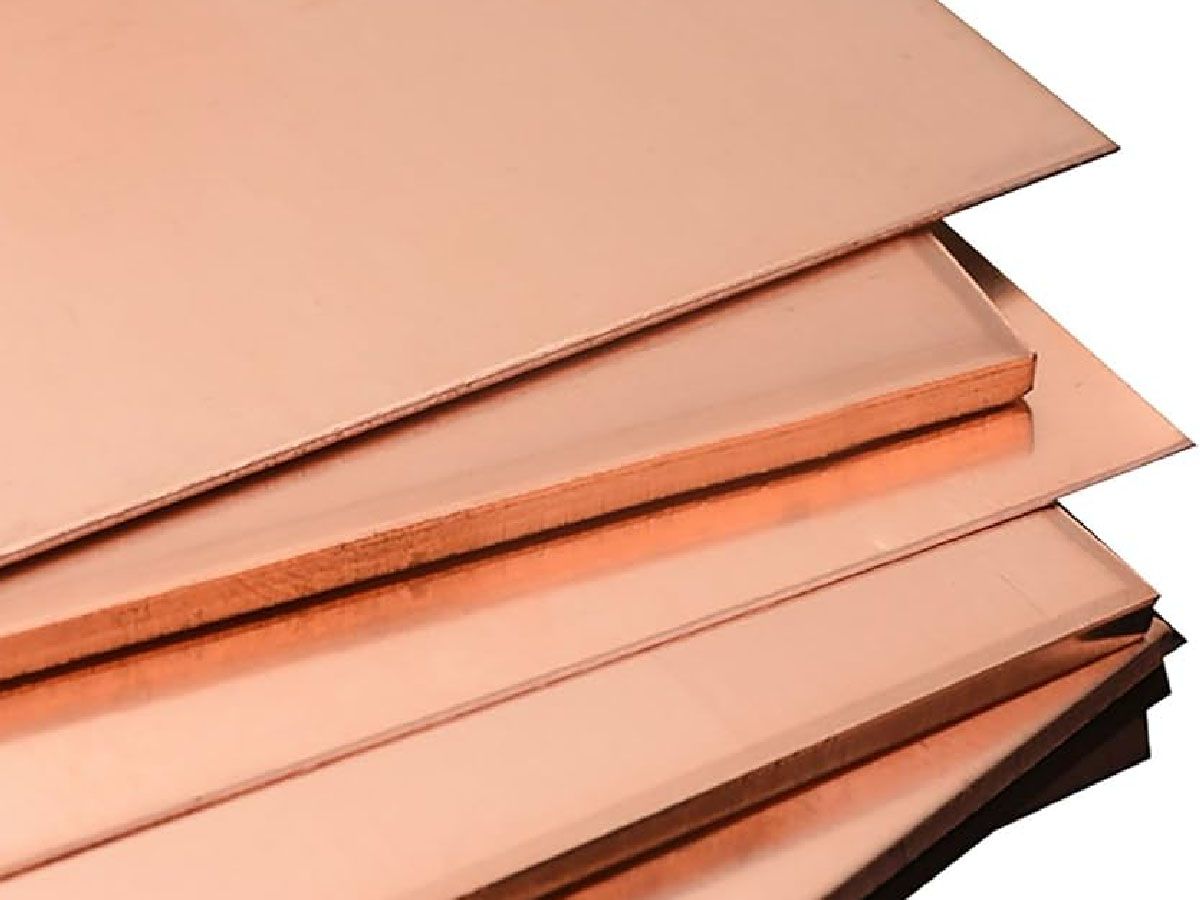 Stacked copper sheets with a smooth surface and rectangular shape.
